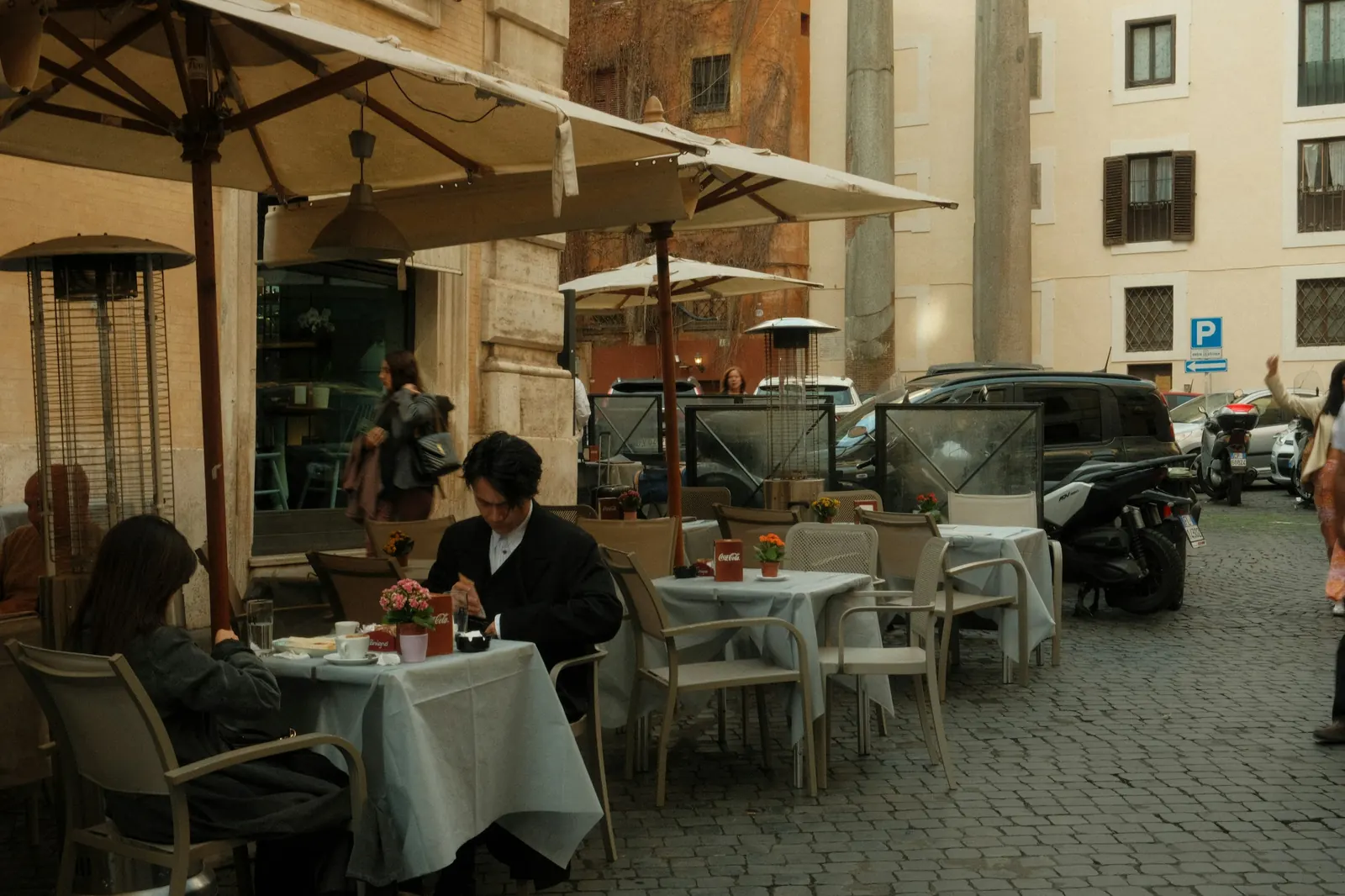Guests at an outdoor café terrace in Rome